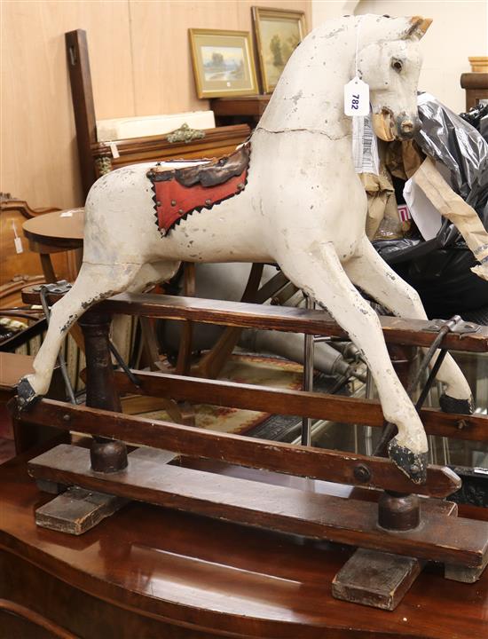 A Victorian carved painted rocking horse W.91cm